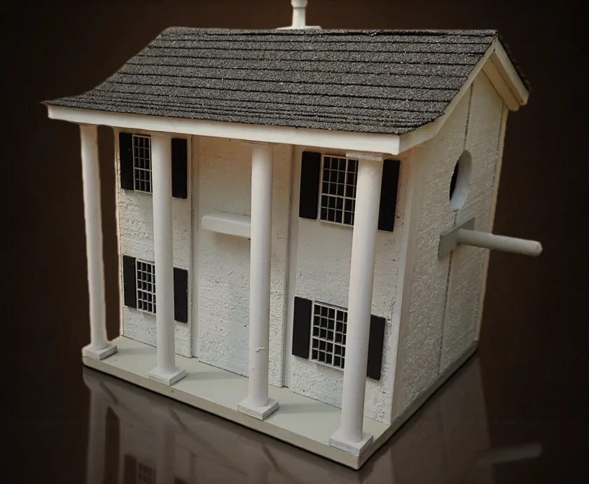 Custom colonial birdhouse made to resemble a home