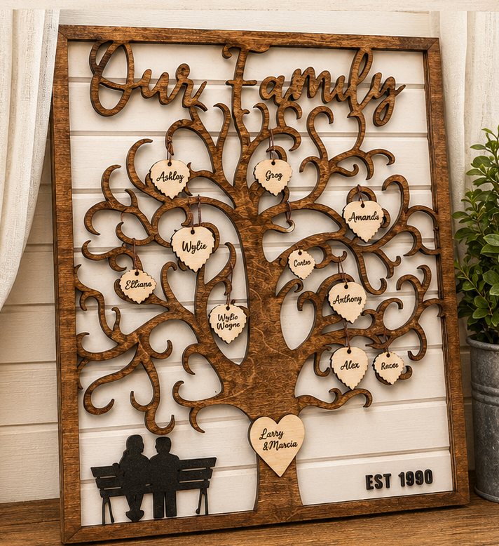 Layered wood "Our Family" tree with family names on heart tags, a couple on a bench and an established year