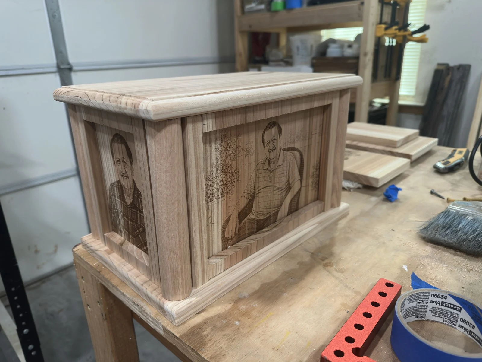 Rounded wood corners and framed panels on an urn in the shop
