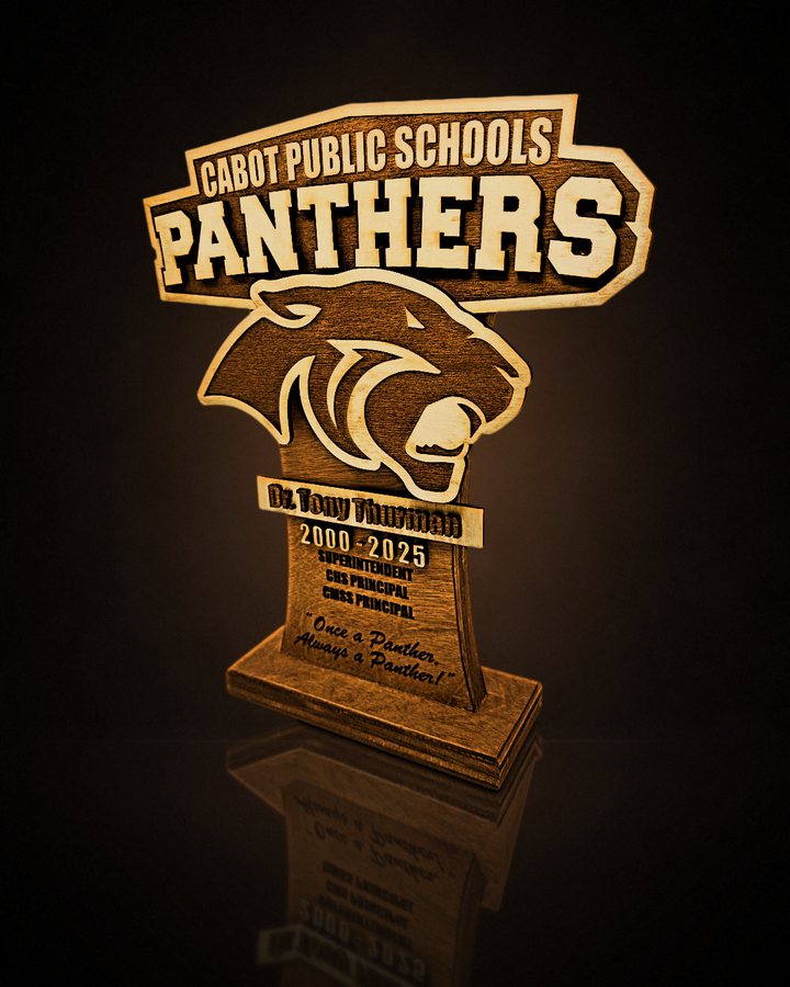 Cabot Public Schools Panthers layered retirement award on a black mirror floor