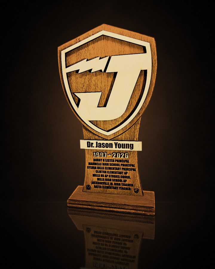Layered maple and walnut shield award with a J emblem and engraved career plate