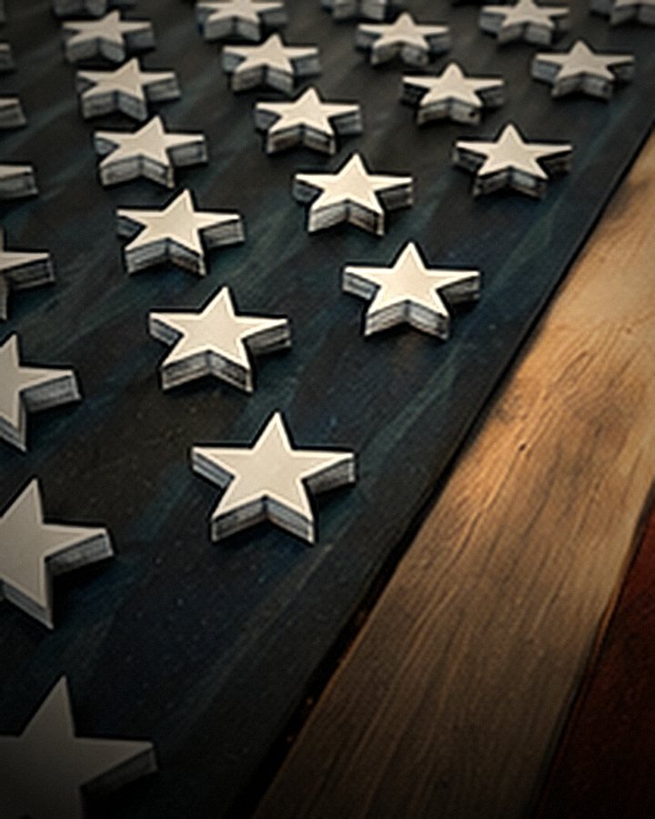 Close-up of raised wooden stars on a handmade burned-wood flag